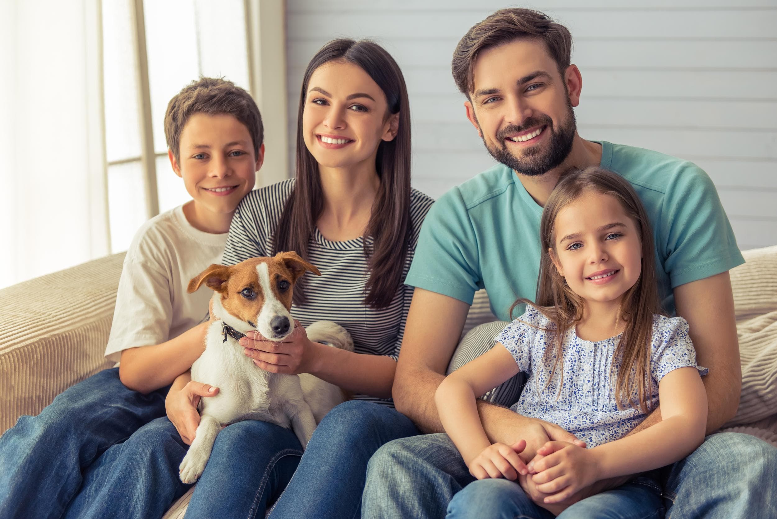 A family at home with their dog